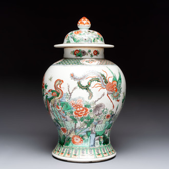 A Chinese famille verte 'phoenixes' vase and cover, 19th C.