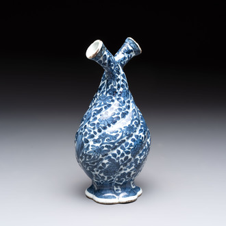 A Chinese blue and white double-spouted swirling-lobed cruet, Kangxi