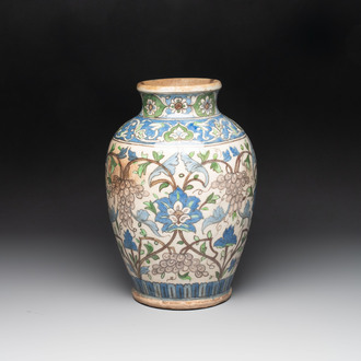 A Qajar polychrome pottery 'flower scroll' vase, Iran, 19th C.