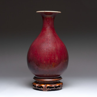 A large Chinese flambé-glazed 'yuhuchunping' vase on a wooden stand, 19th C.