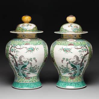 A pair of Chinese verte-biscuit vases and covers with cranes and flowers, 19th C.