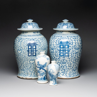 Two Chinese blue and white 'double happiness' covered vases and two 'meiping' vases, Kangxi mark, 19th C.
