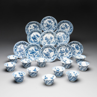 12 Chinese blue and white cups and 11 saucers with birds among flowering branches, Kangxi