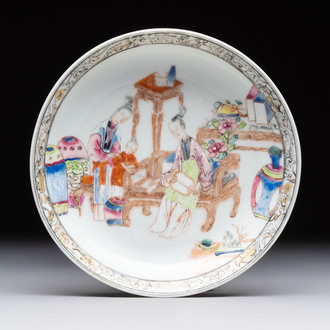 A Chinese famille rose saucer with two ladies and a boy, Yongzheng