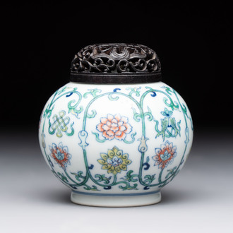 A Chinese doucai 'bajixiang' vase with a reticulated wooden cover, Yongzheng mark, 19/20th C.