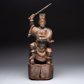 A Chinese gilt-lacquered wooden sculpture of a guardian, 19th C.
