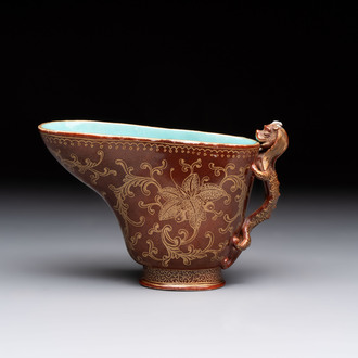 A Chinese gilt-decorated brown-glazed libation cup with a chilong-form handle, Qianlong mark and of the period