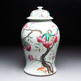 A Chinese famille rose 'nine peaches' vase and cover, 19th C.