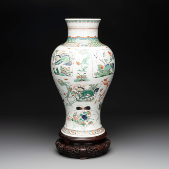 A fine Chinese famille verte 'mythical creatures' vase on a reticulated wooden stand, Kangxi