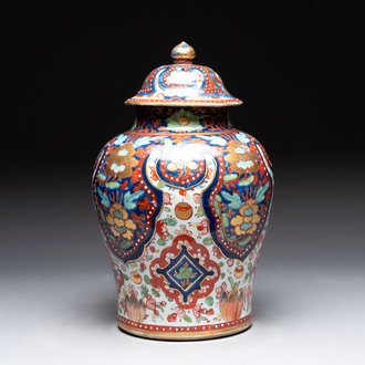A Chinese English-decorated blue and white vase and cover, Kangxi