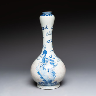 A Chinese blue, white and copper-red garlic-mouth vase with mythical animals, Kangxi mark, 19th C.