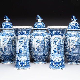 A blue and white Dutch Delft garniture of five vases and covers, 19th C.