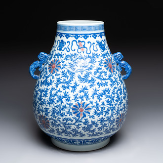 A Chinese blue, white and copper-red 'hu' vase with lotus scrolls, Qianlong mark, 19th C.