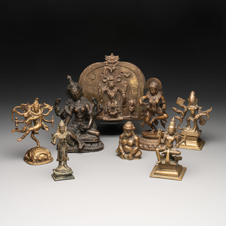 Seven bronze figures of deities and a religious relief plaque, India and Nepal, 18/19th C.