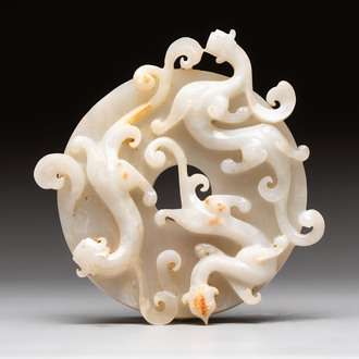 A Chinese carved white and russet jade bi-disc with chilong design, 19/20th C.