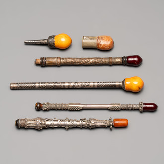 Four Ottoman silver niello cigarette holders with amber and cherry amber, and two hookah mouthpieces for the Islamic market, 19th C.