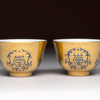 A pair of Chinese gilt-and blue-enamelled 'shou 壽' cups, Daoguang mark and possibly of the period