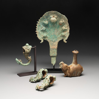 A collection of a bronze sculpture, three palanquin hooks and an elephant-form kendi, Cambodia, 13th C. and earlier