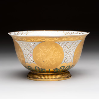 A Chinese white-glazed European-decorated reticulated bowl with gilt-bronze mount, Transitional period
