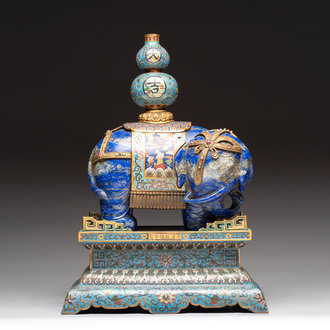 A Chinese lapis lazuli and cloisonné elephant on stand, 19/20th C.