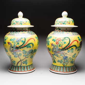 A pair of Chinese famille verte yellow-ground 'pheasants and peonies' vases and covers, 19th C.