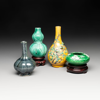 Four Chinese monochrome wares and two wooden stands, 19th C.