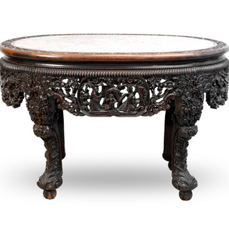 A Chinese finely carved hongmu marble top oval table, Canton, 19th C.