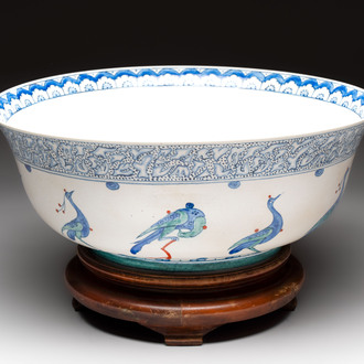 A large polychrome Iznik-style 'peacocks' bowl on a wooden stand, Samson, Paris, 19th C.