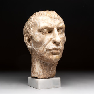 An Italian Grand Tour marble sculpture of a man's head in Roman style, probably after a bust of Caesar, 19th C.