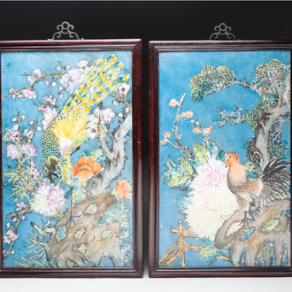 Two Chinese polychrome 'peacock' and 'rooster' plaques with wooden frames, 20th C.
