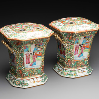 A pair of Chinese Canton famille rose flower holders and covers with figural design, 19th C.