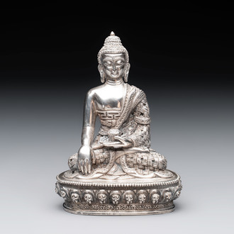 A fine Nepalese silver Buddha, 20th C.