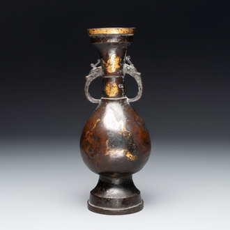 A Chinese parcel-gilt bronze vase with dragon-form handles, Yuan/Ming