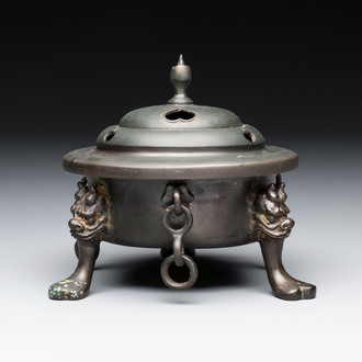 A Chinese bronze tripod censer and cover, Sui/Tang