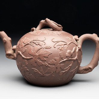 A Chinese Yixing stoneware 'squirrels among grapevines' teapot and cover, Kangxi