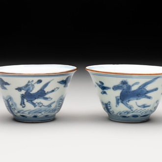 A pair of Chinese blue and white 'flying horses' cups, Jiajing mark, Kangxi