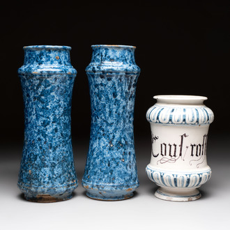 A pair of Spanish splashed blue pottery albarelli and an Italian blue, white and manganese albarello, Savona, 17/18th C.