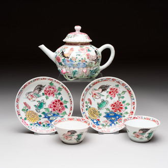 A Chinese famille rose 'roosters' covered teapot and two cups and saucers, Yongzheng