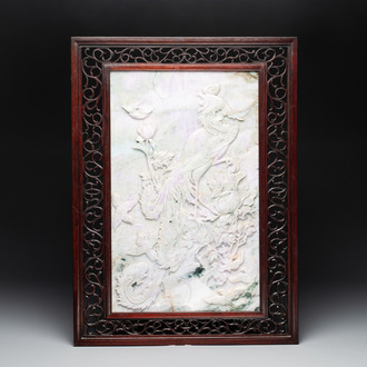 A Chinese lavender and green jadeite 'phoenix' plaque in a hongmu frame, early 20th C.
