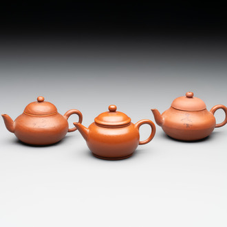 A small Chinese Yixing stoneware covered teapot and two Swatow Yixing-style covered teapots, Yixing Hui Mengchen 宜興惠孟臣製 and Shunji 順記 marks, 19/20th C