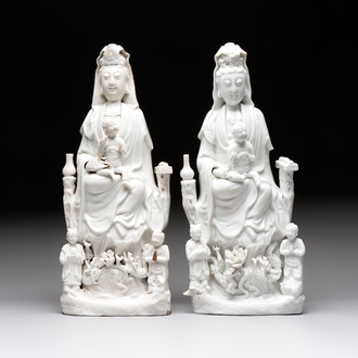 A pair of Chinese Dehua blanc de Chine groups of Guanyin with a child and servants, 18th C.