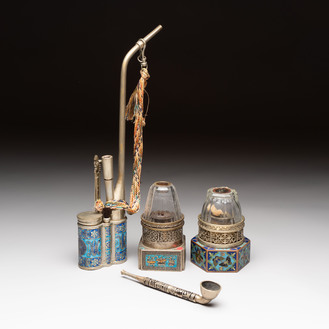 Two Chinese enamelled paktong opium pipes, an opium lamp and a cloisonné opium lamp, 19/20th C.