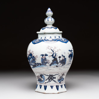 A blue, white and manganese Dutch Delft chinoiserie vase and cover, ca. 1700