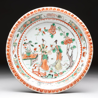 A Chinese famille verte 'elegant beauties in a garden' plate, Kangxi