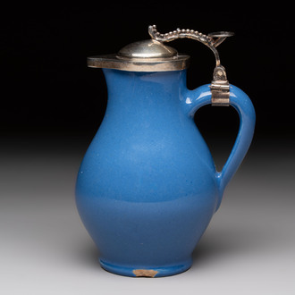 A very rare blue-glazed Dutch Delft jug with a mounted silver cover, 18th C.