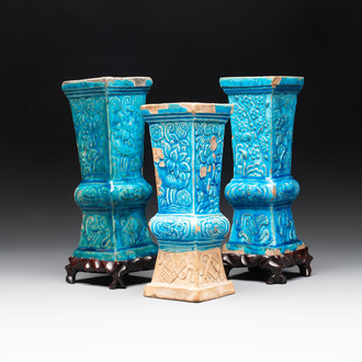Three Chinese turquoise-glazed 'gu' vases with floral design, two with wooden stands, Ming
