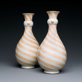 A rare pair of Chinese pear-shaped bottle vases with iron-red swirls, Kangxi