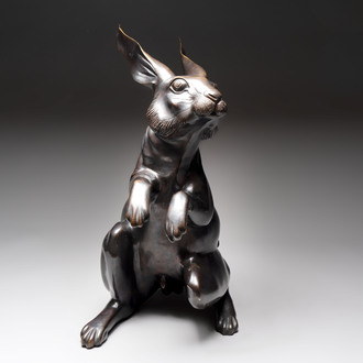 A large Japanese bronze sculpture of a sitting hare, 20th C.