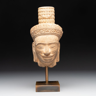 A Khmer Angkor Wat-style sandstone head of Shiva, probably 12th C.