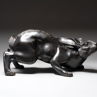 A large Japanese bronze sculpture of a reclining hare, 20th C.